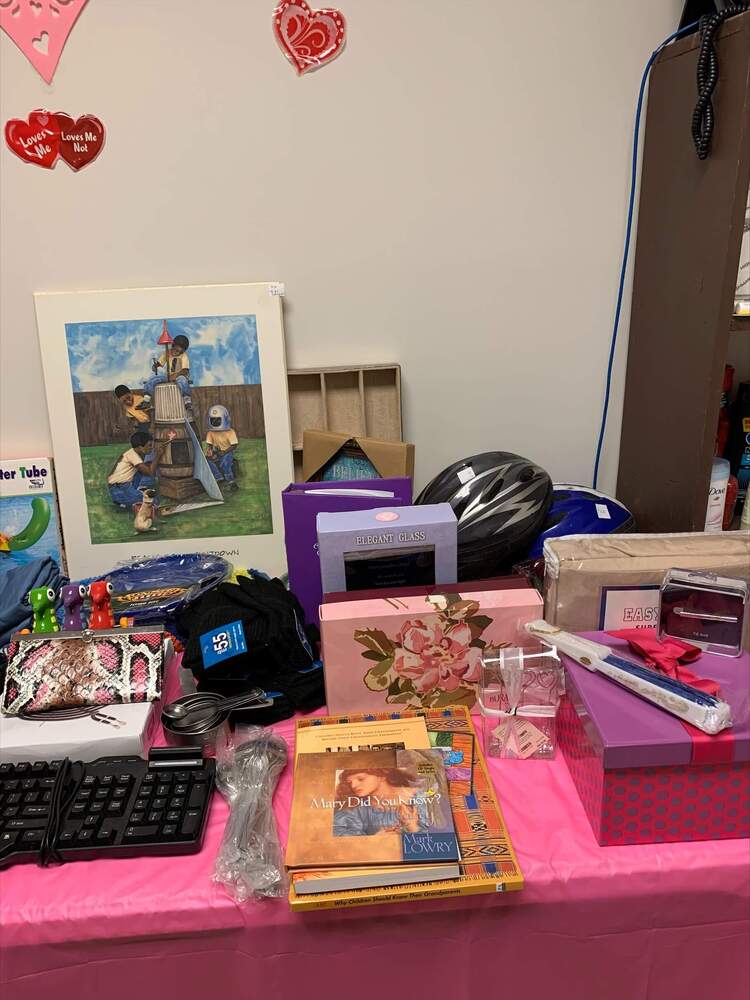 A closeup of thrift store items for sale on a table