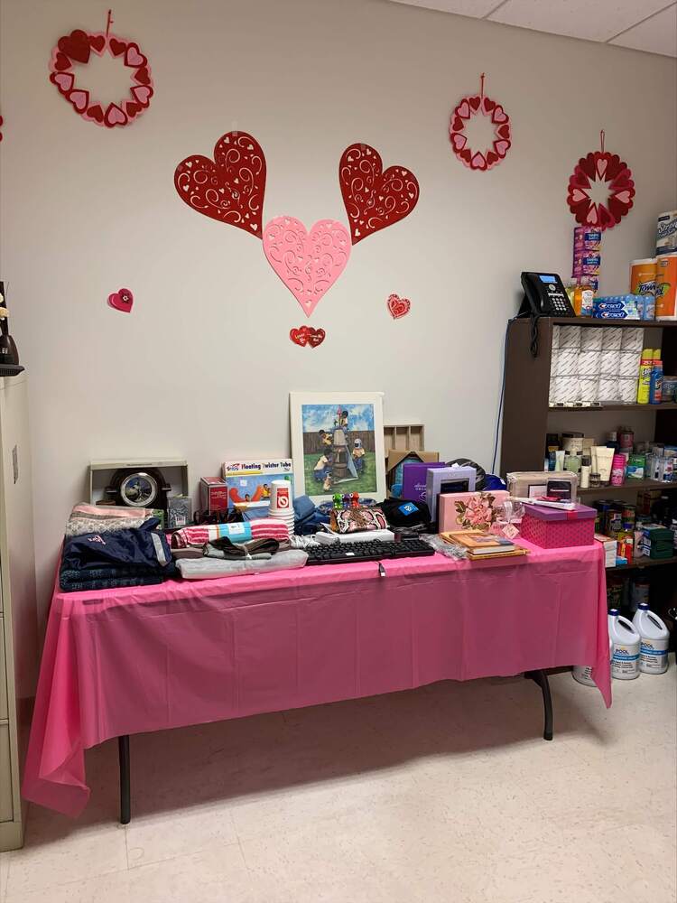 items displayed on a pink table that are for sale