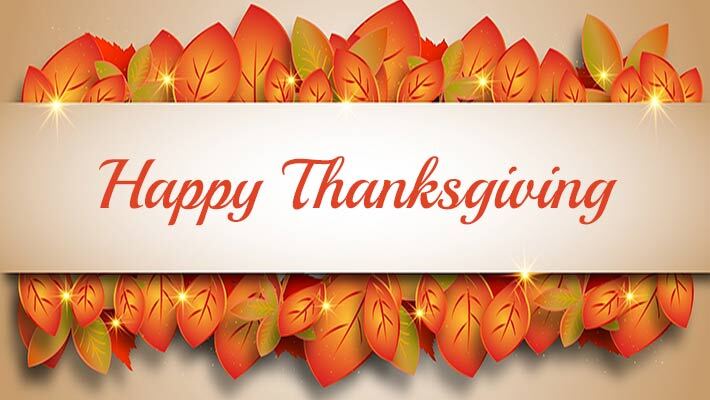 The words "Happy Thanksgiving" on a backdrop of leaves.