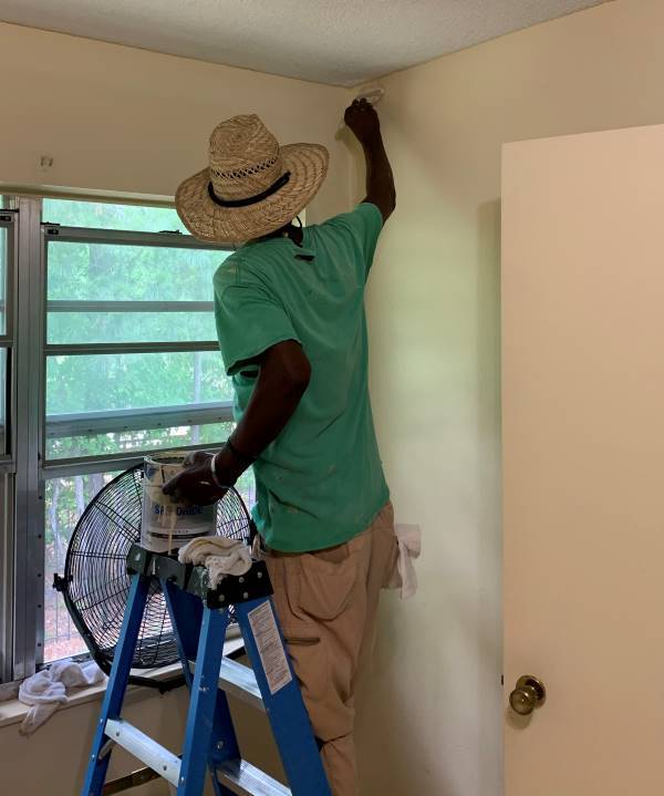 Charlies Mott Painting Walls.