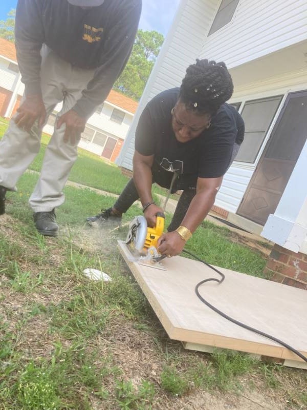 S. Hodges cutting a door. 